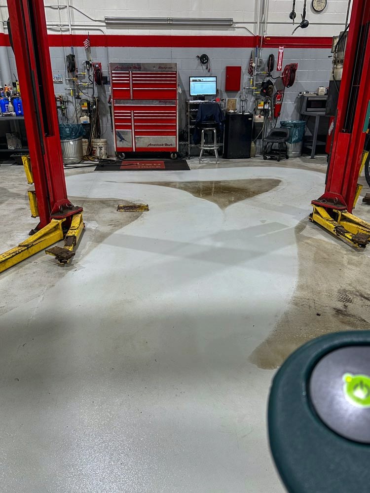 The same service bay floor after Stay Clean machine scrubbing